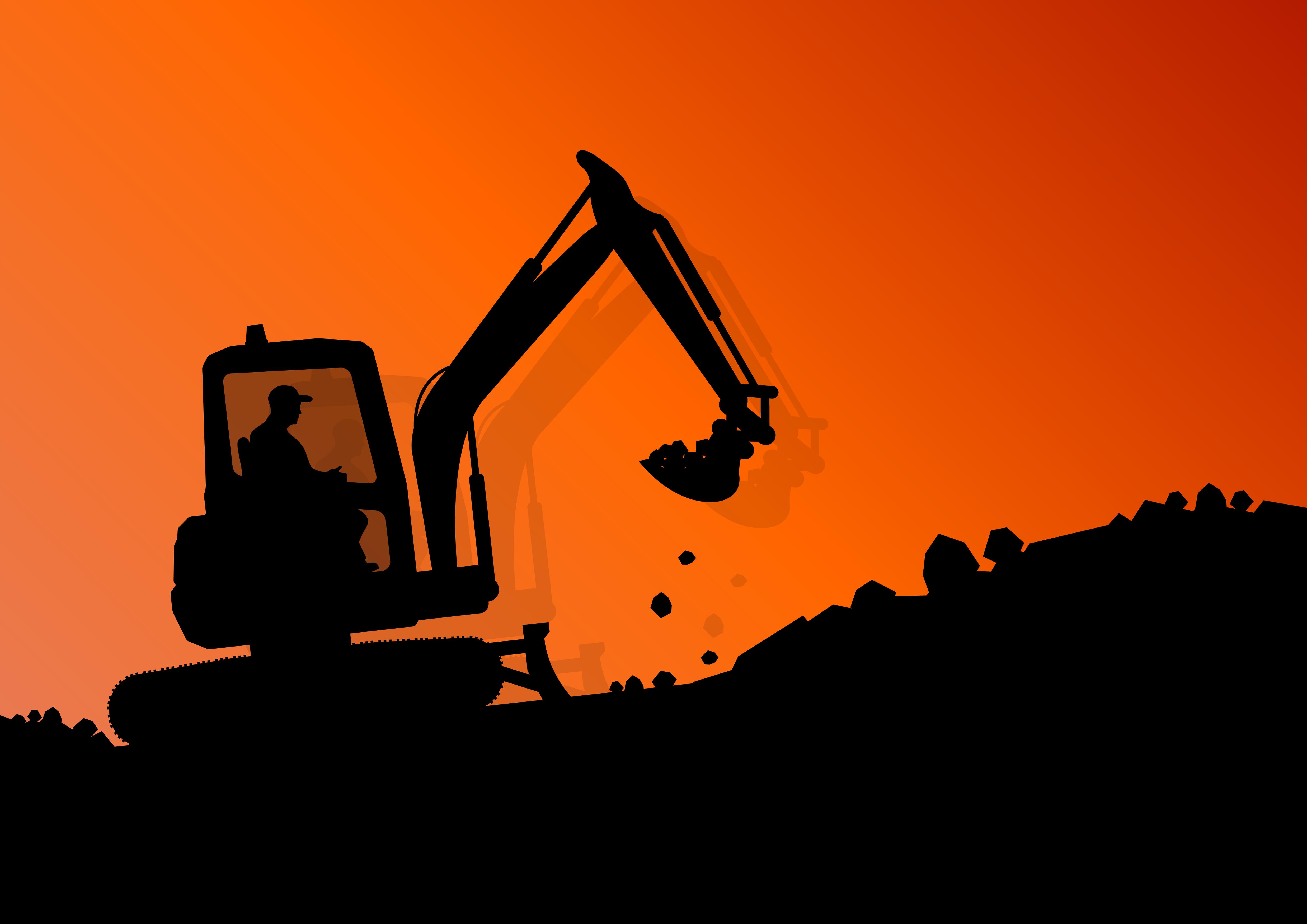 Excavator at sunset in silhouette